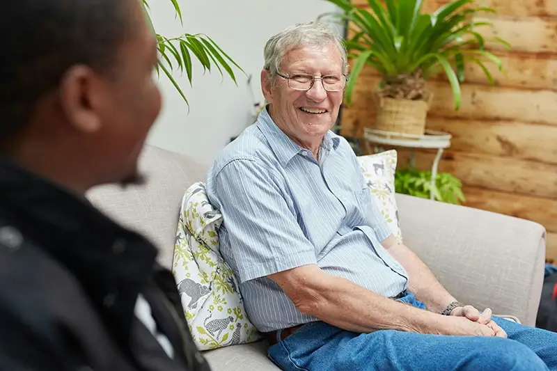 Man talking to Community Health Worker