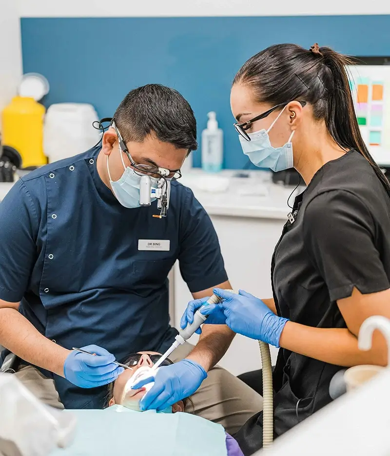 Dentists treating patient