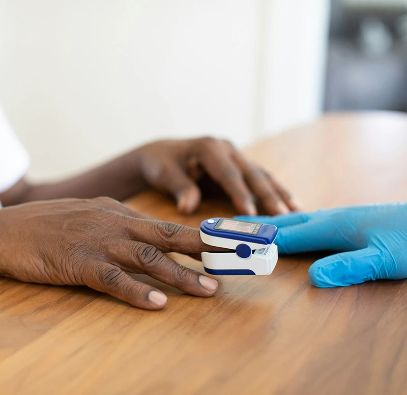 Professional checking patient's oxygen levels